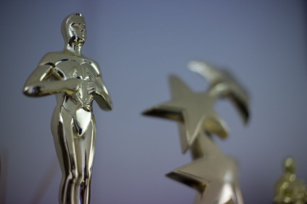 Award statuettes on the office shelf