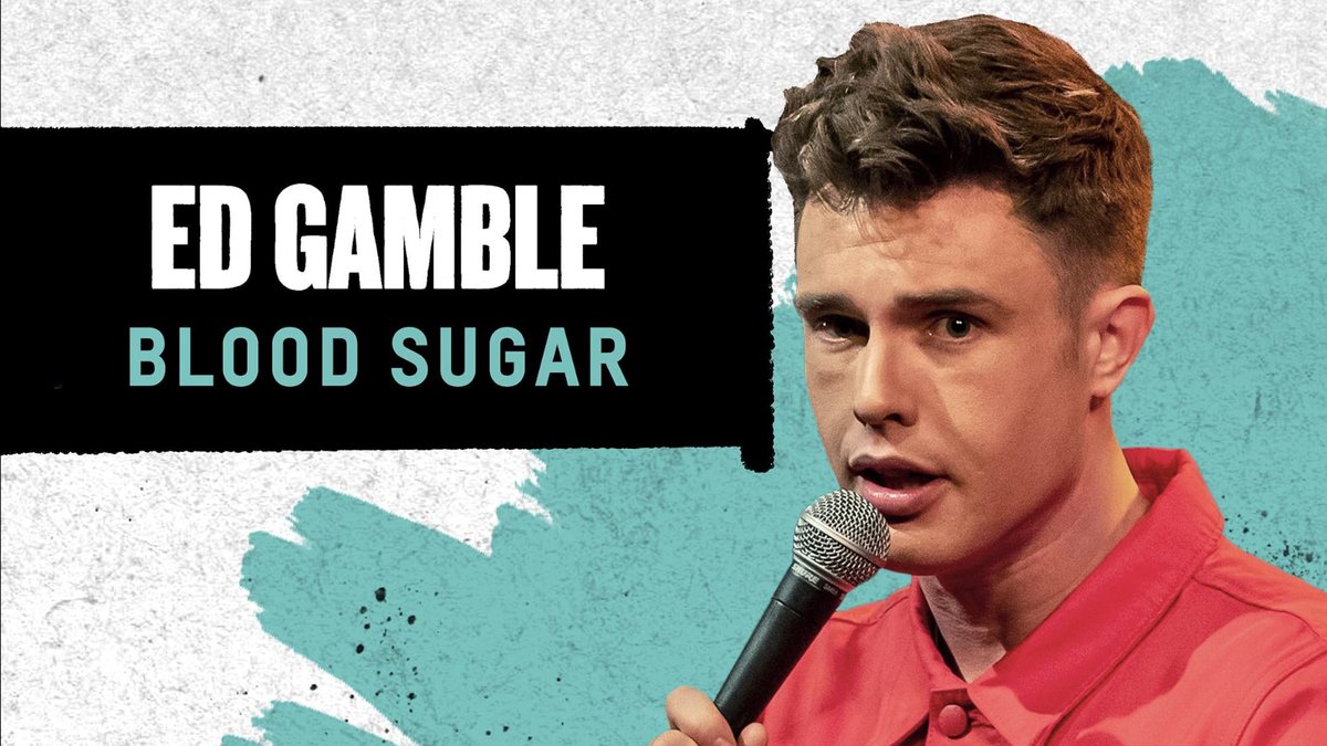 Ed Gamble at the mic beside the Blood Sugar title
