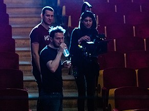 Crew checking a shot from the theatre stalls during rehearsal