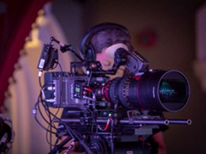 Cinema camera rig with a large lens, ready for the show