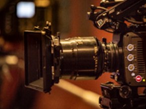 Close-up of an anamorphic lens and matte box on a camera