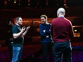 Director talking through the show with the crew on stage
